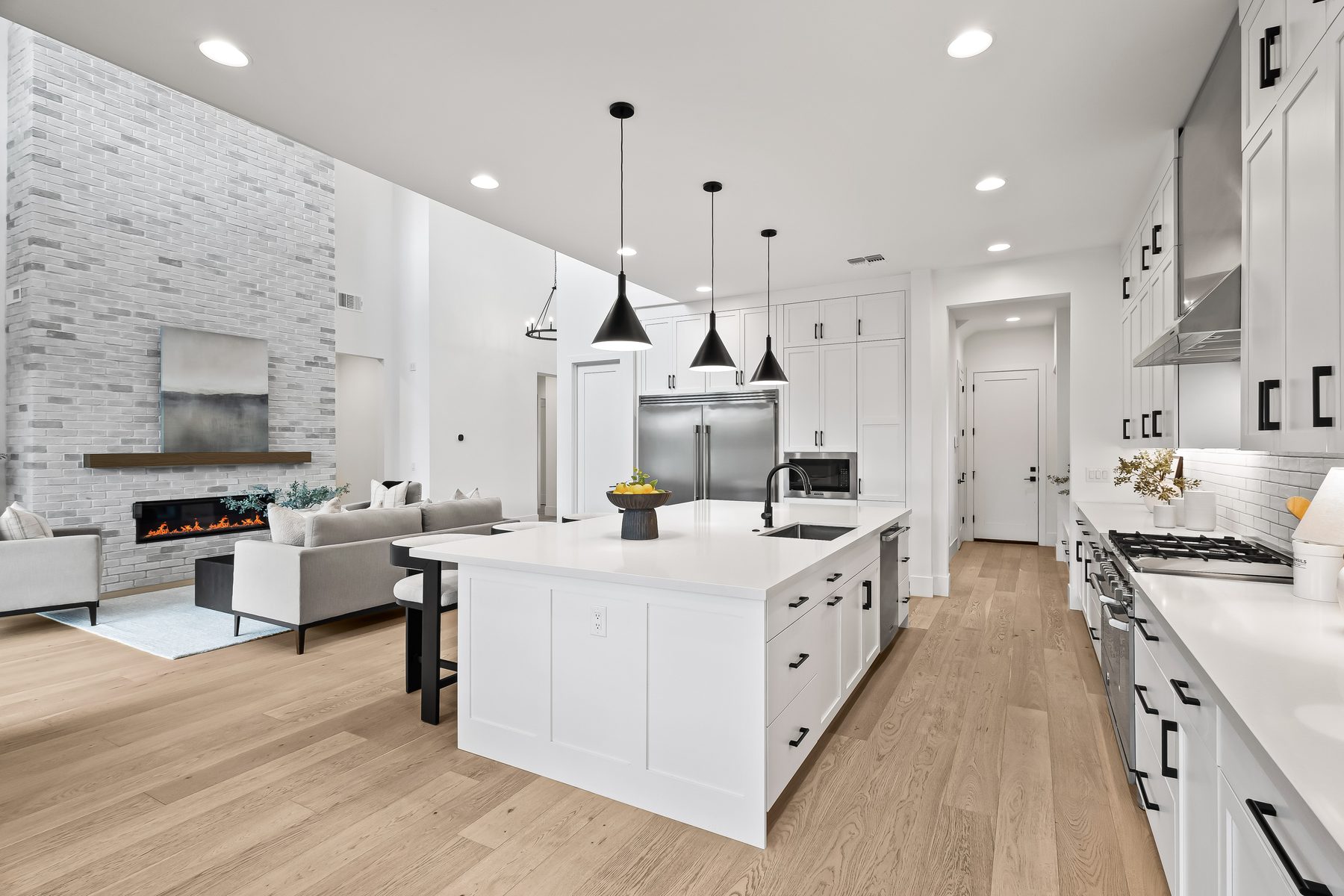Open floor plan with kitchen island and great room at 5513 E Verde Lane in Lower Arcadia